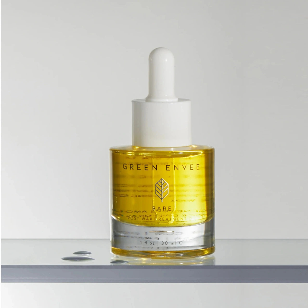 Green Envee Post Wax Oil with salicylic acid to prevent ingrown hairs, unclog pores, and reduce post-wax bumps.