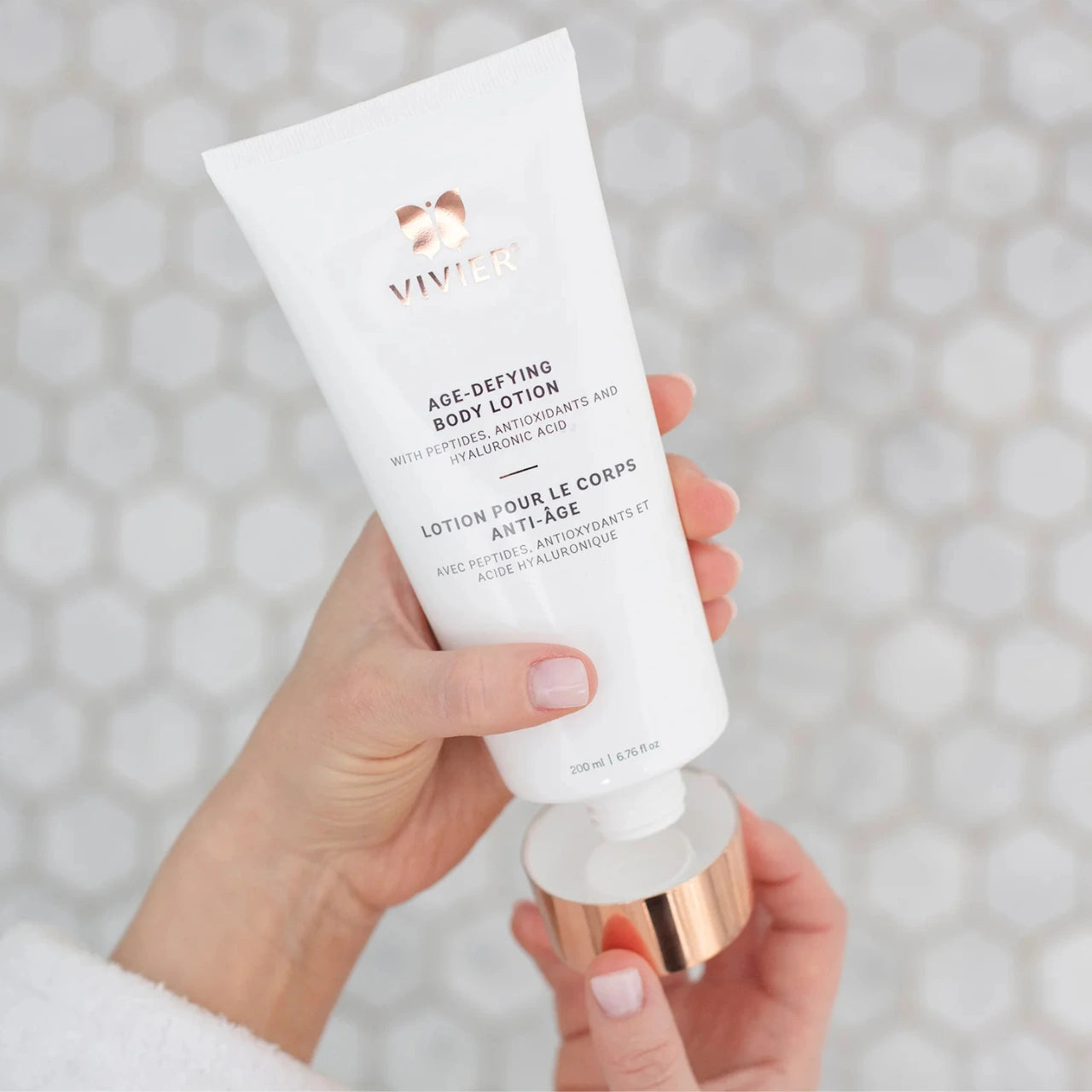 Vivier® Age-Defying Body Lotion infused with vitamin C and E protects against free radicals, promoting radiant and healthy skin.