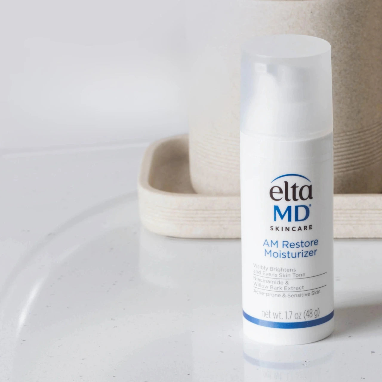 EltaMD AM Restore Moisturizer brightens and evens skin tone with Niacinamide, reducing dark spots and redness for a balanced complexion.