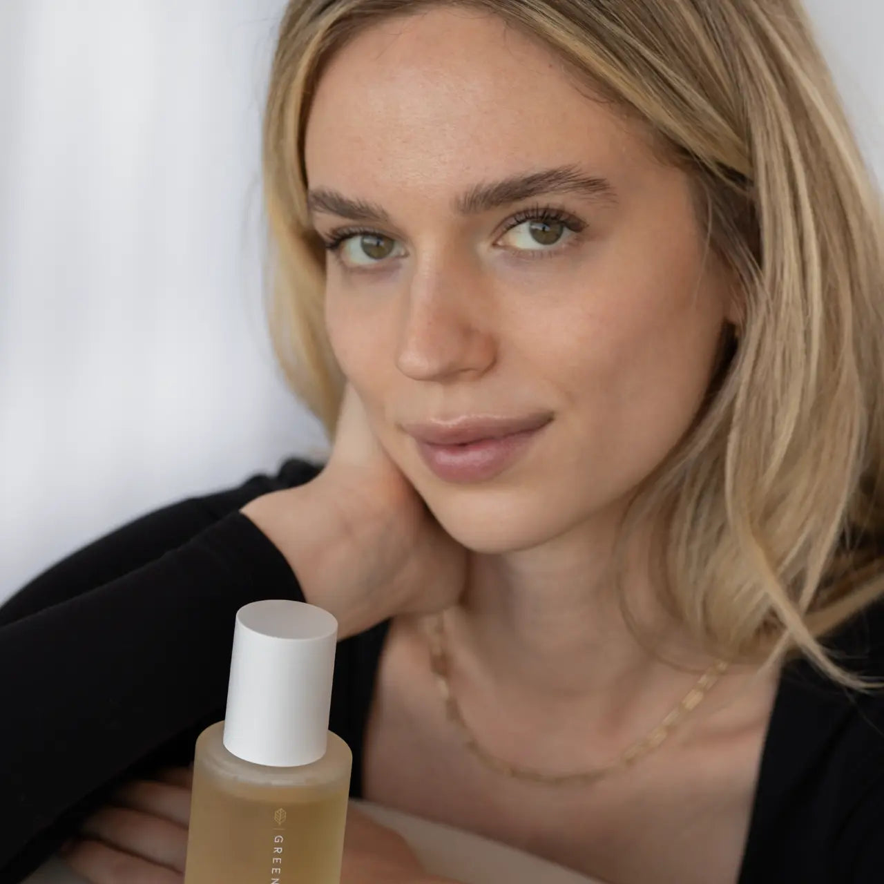Green Envee Bright Facial Mist enhancing a radiant, healthy glow.