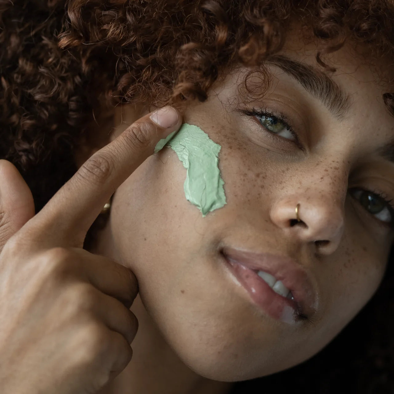 Green Envee Potent C Superfood Masque helps brighten skin and promote a more even skin tone.