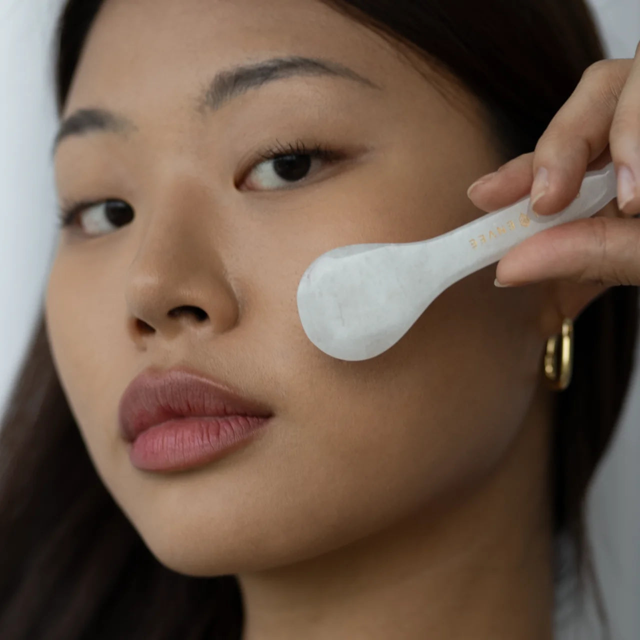 Green Envee White Jade Gua Sha Eye Tool helps depuff and refresh the delicate under-eye area with natural cooling and massage.
