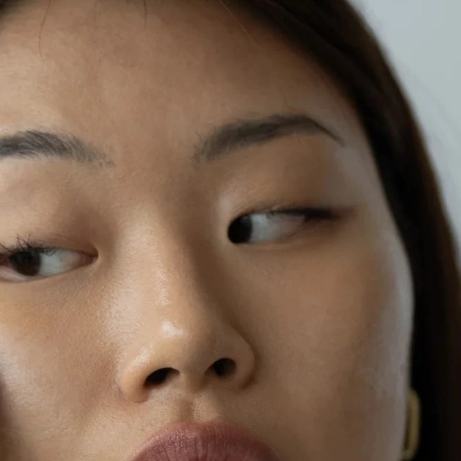 Green Envee White Jade Gua Sha Eye Tool lifts and smooths fine lines, enhancing firmness and rejuvenating tired eyes.