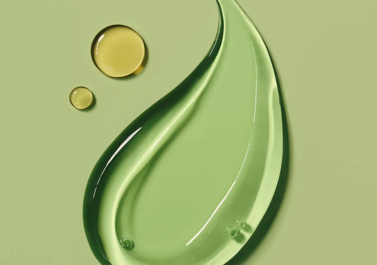 Hydrating gel and oil skincare ingredients on a green background.