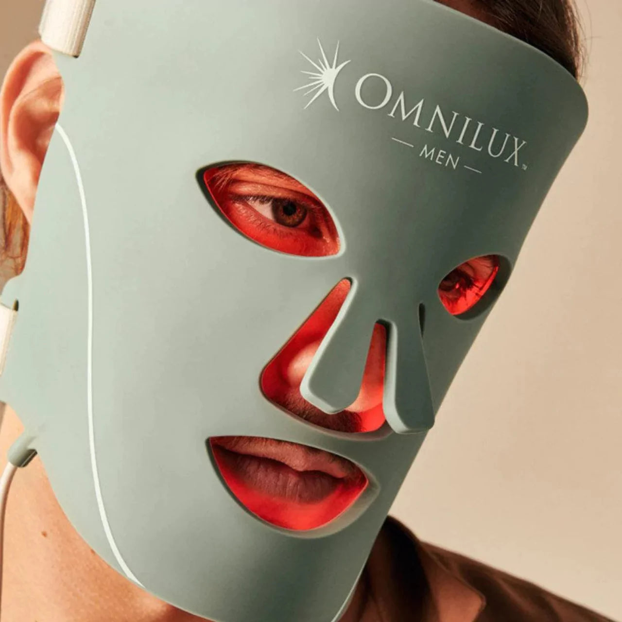 Omnilux Men LED mask calming skin irritation and redness for a healthier complexion.